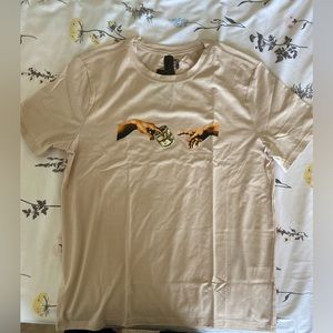 Adán and God’s Hand Print Tee.